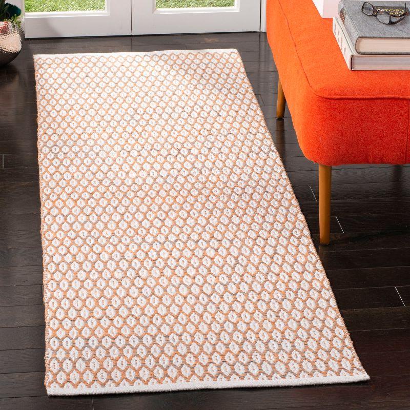 Ivory and Orange Handwoven Cotton Area Rug