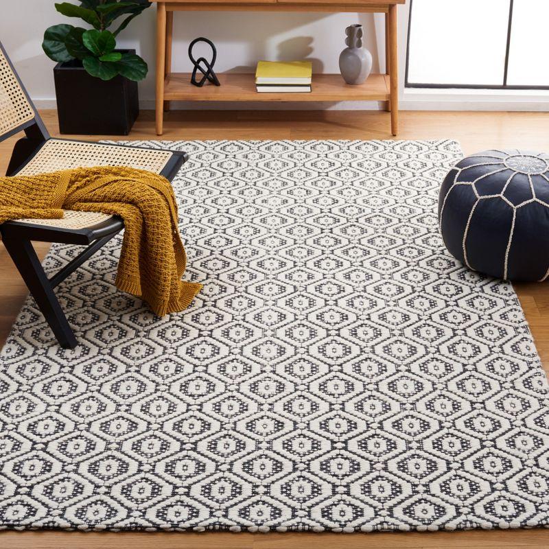 Elegant Marbella Black and Ivory Hand-Woven Flatweave Wool Blend Rug