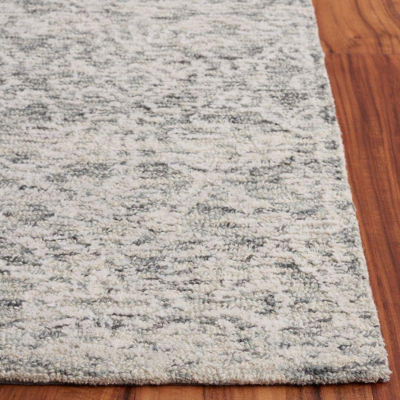 Ivory Tufted Handmade Wool 8' x 10' Area Rug