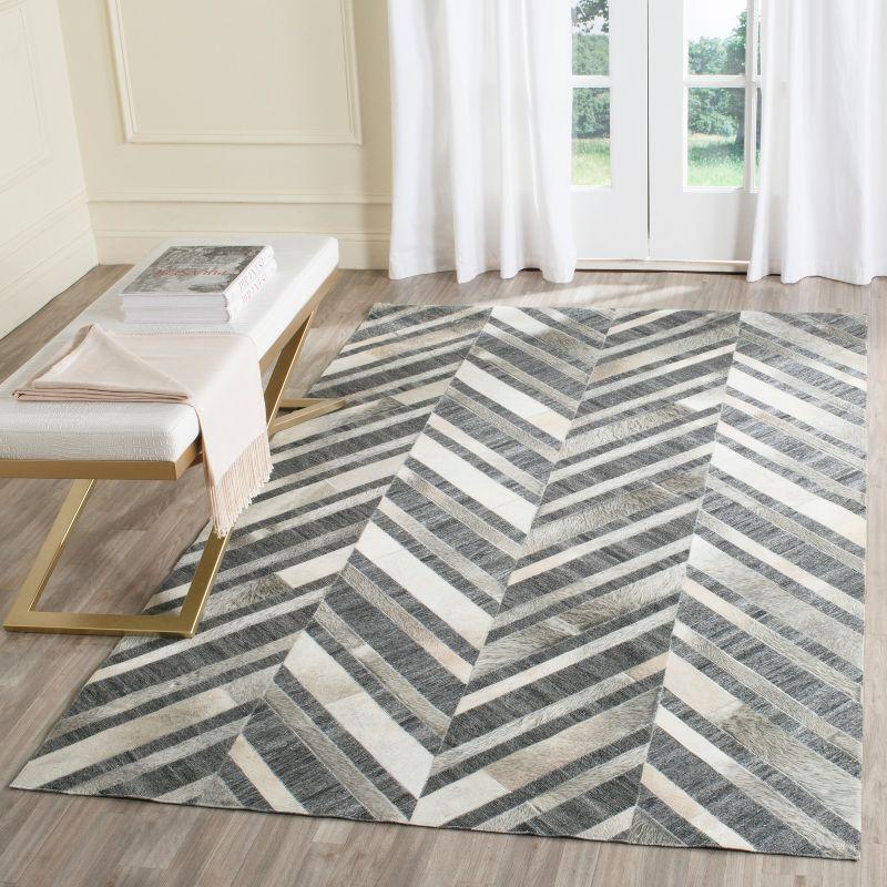 Ivory and Dark Grey Handmade Geometric Cowhide Area Rug