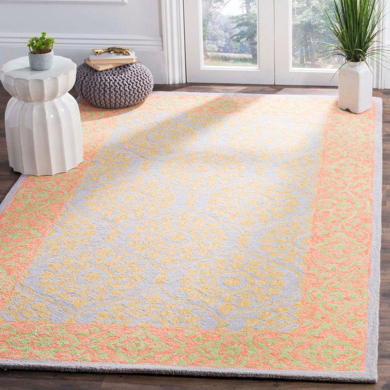 Handmade Orange and Silver Floral Wool Area Rug 3' x 5'