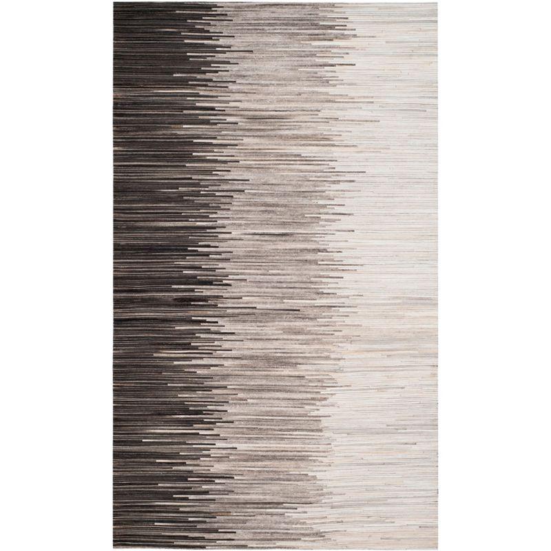 Handmade Ivory and Charcoal Geometric Cowhide Area Rug