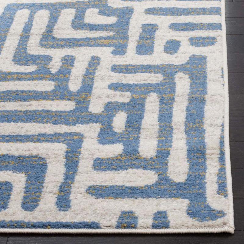 Ivory and Light Blue Geometric Low Pile Area Rug