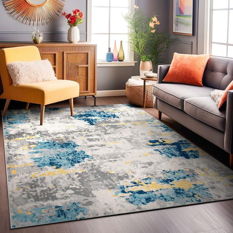 Cream and Blue Abstract Synthetic 5' x 7' Area Rug