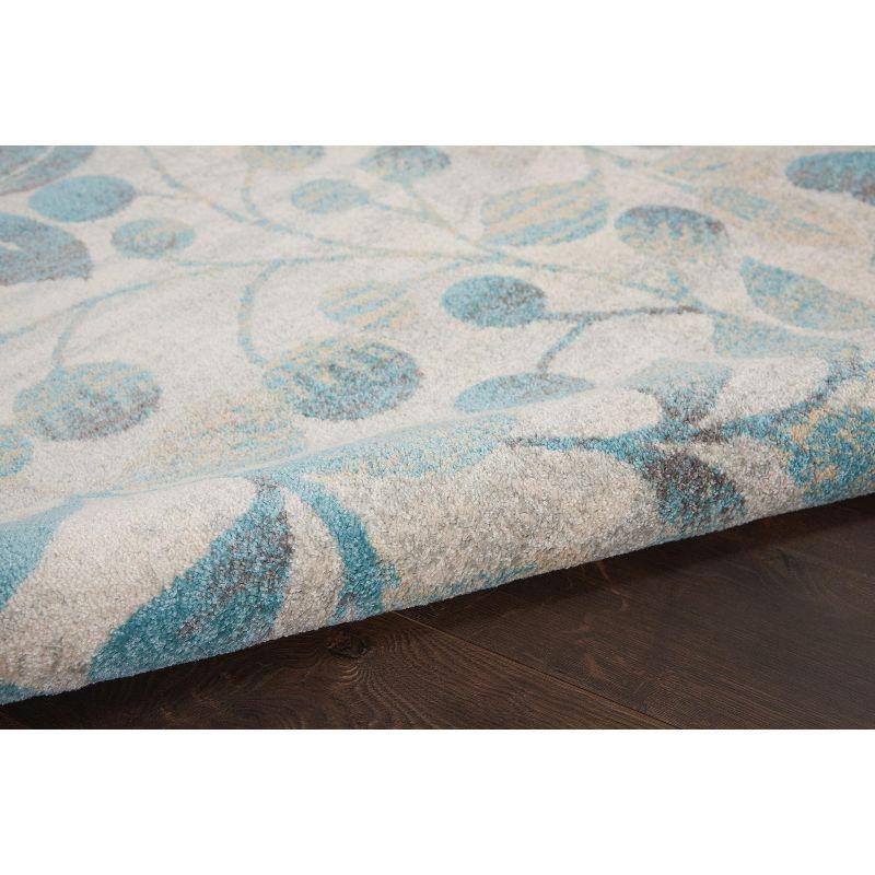 Ivory and Turquoise Floral Synthetic 4' x 6' Area Rug