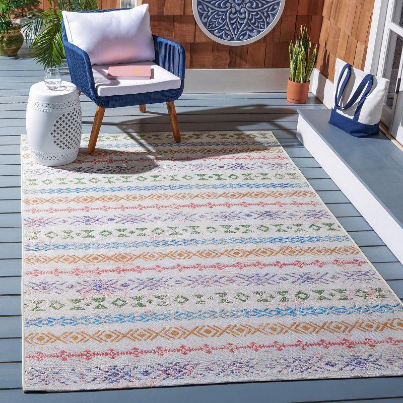 Ivory and Blue 4' x 6' Stain-Resistant Synthetic Area Rug