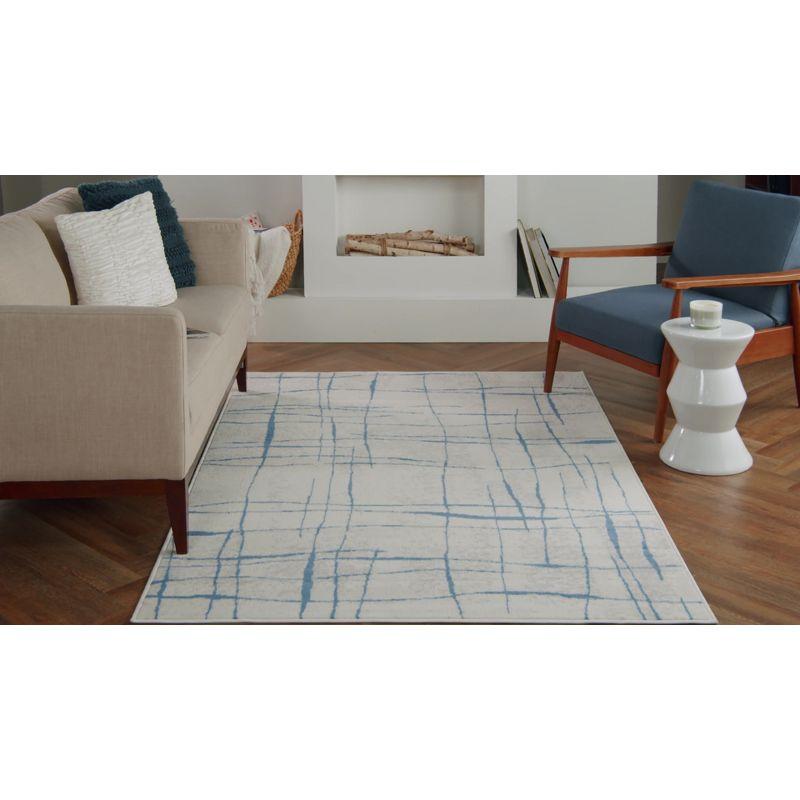 Ivory and Pink Abstract Synthetic 6' x 9' Area Rug