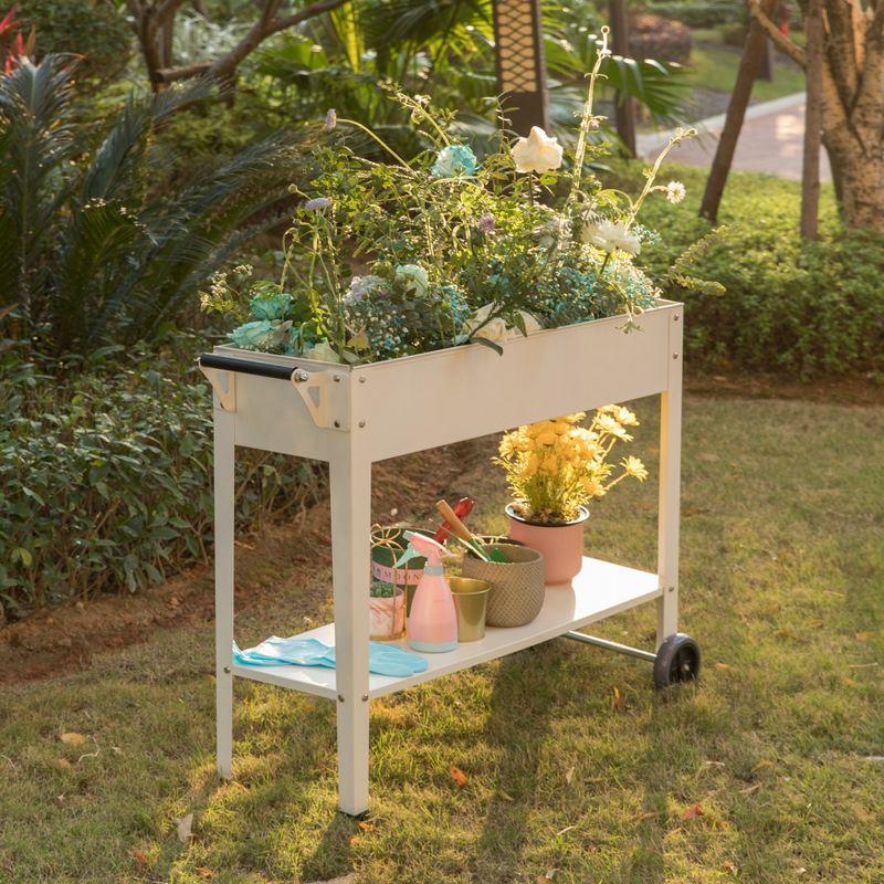 Elevated White Metal Mobile Planter Cart with Storage Shelf