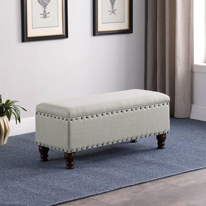 Gray Upholstered Storage Bench with Nailhead Trim and Walnut Legs