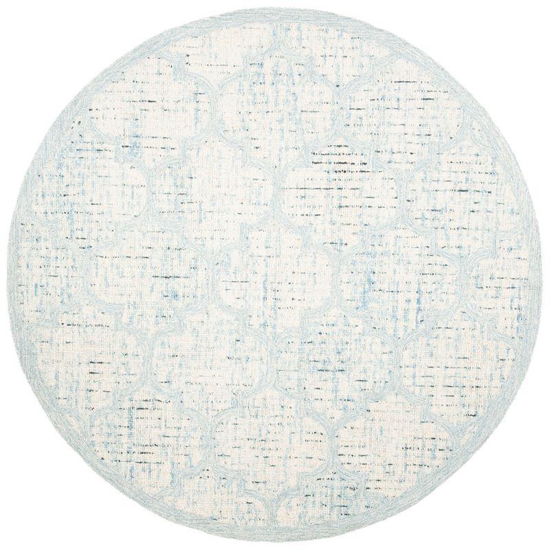 Ivory and Turquoise Round Tufted Wool Area Rug