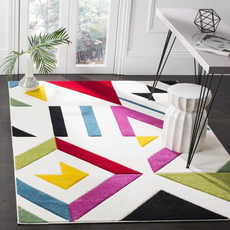 Ivory and Multicolor Geometric 4' x 6' Synthetic Area Rug