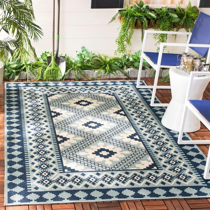 Blue and Ivory Synthetic Easy Care Indoor/Outdoor Rug