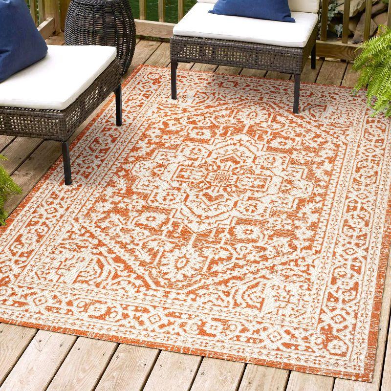 9' x 12' Sinjuri Medallion Textured Weave Indoor/Outdoor Area Rug, Orange/Cream - JONATHAN Y