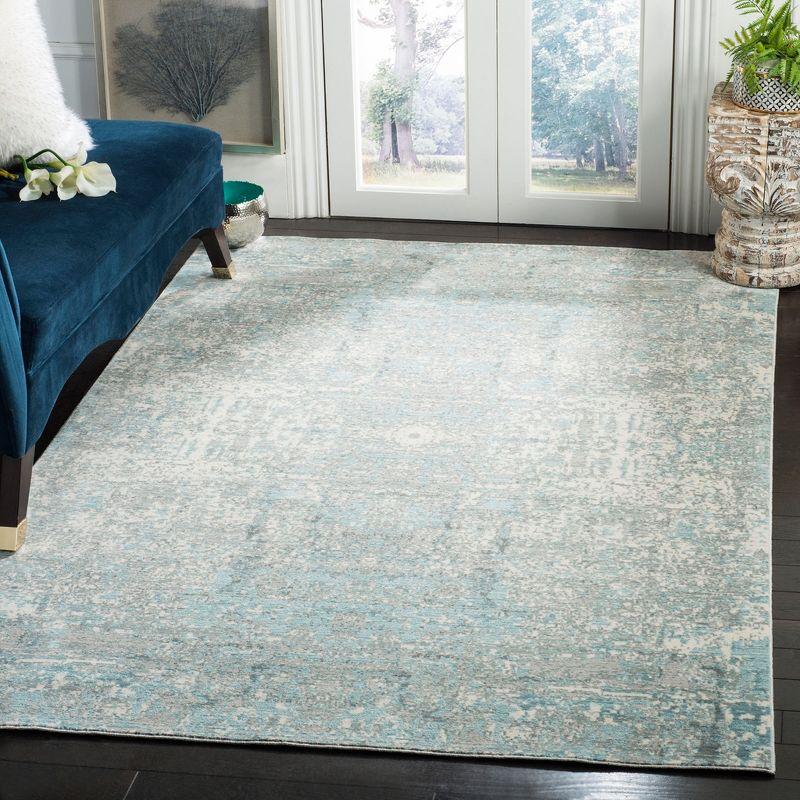 Teal and Multicolor Abstract Synthetic 4' x 6' Area Rug