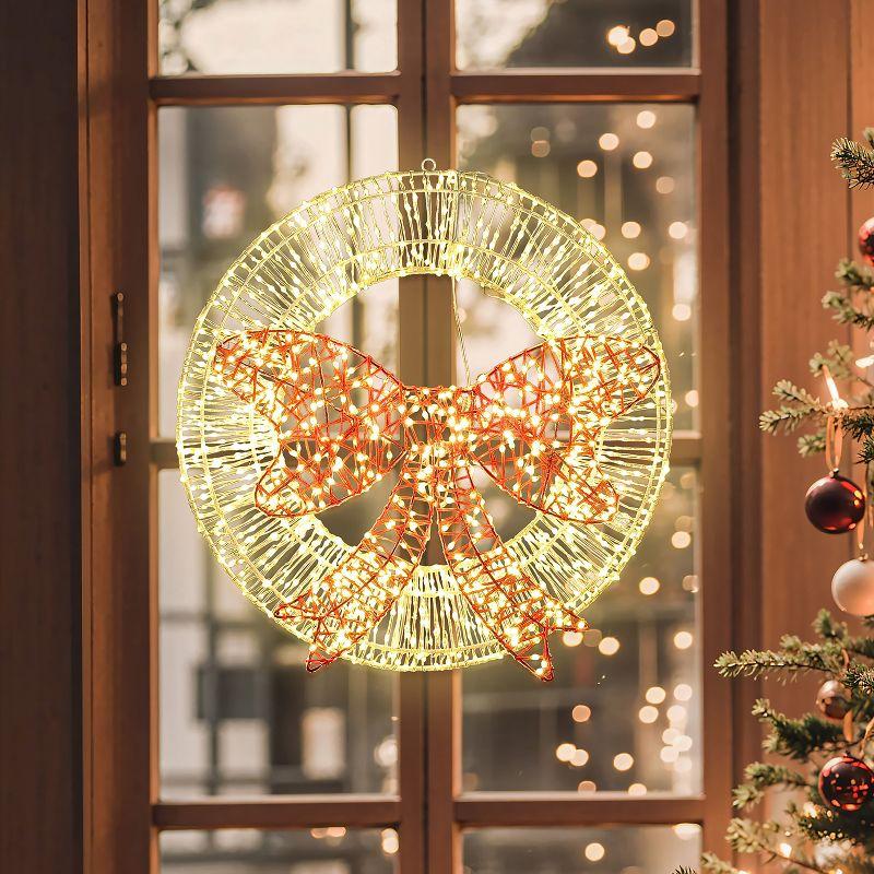 LuxenHome 1.6Ft Round Light Wreath and Red Light Bow Holiday Decoration with Timer Clear