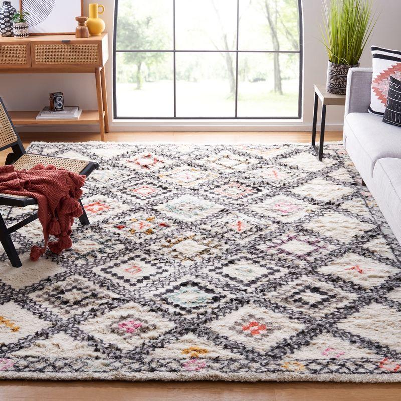 Elevated Tribal Black Wool 6' x 9' Hand-Knotted Area Rug