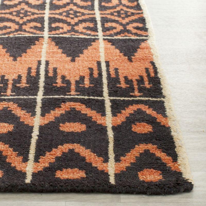 Union Rustic Alimatou Hand Knotted Wool/Cotton Southwestern Rug in Orange/Black
