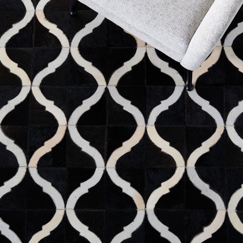 Handmade Black and Beige Geometric Cowhide Area Rug