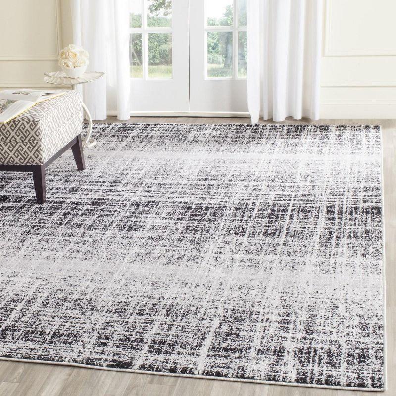 Ivory and Black 8' x 10' Synthetic Abstract Area Rug