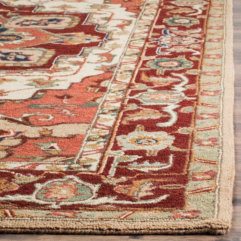 Handmade Red and Ivory Floral Wool Round Area Rug