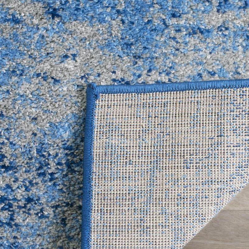 Reversible Silver and Blue Abstract Synthetic Area Rug