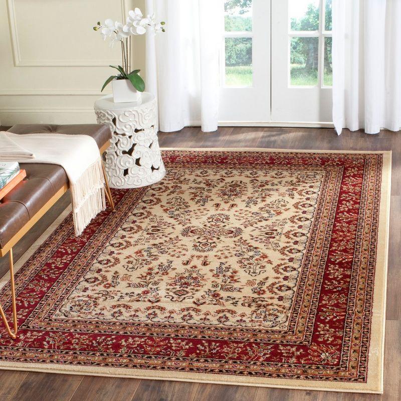 Ivory and Red Synthetic Traditional 4' x 6' Area Rug