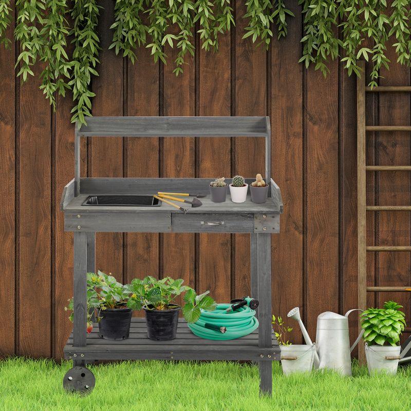 Outsunny Garden Potting Bench Table, Outdoor Wooden Workstation with 2 Removable Wheels, Sink, Drawer & Large Storage Space