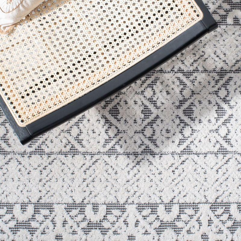 Ivory and Gray Geometric Synthetic Indoor/Outdoor Rug