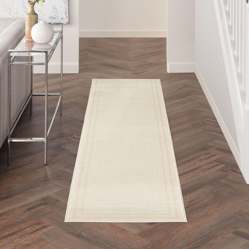 Nourison Essentials 2' x 6' Ivory Gold Contemporary Bordered Indoor/Outdoor Area Rug