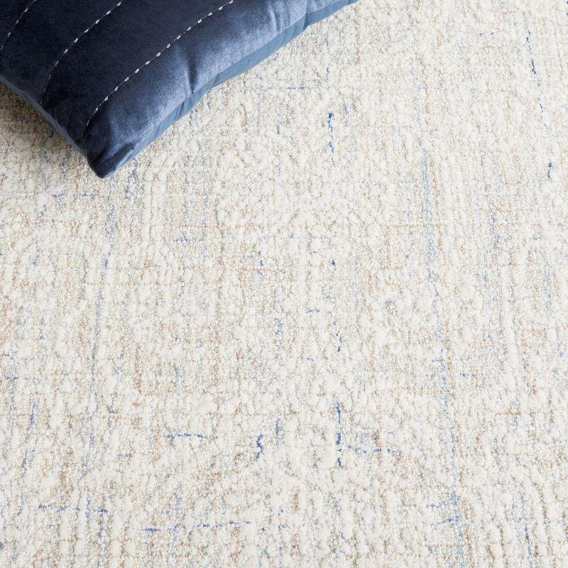 Ebony EBN111 Hand Tufted Area Rug - Blue/Ivory - 5'x8' - Safavieh.