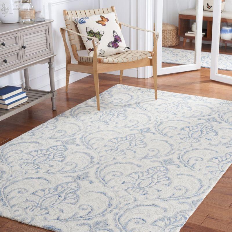 Ivory and Blue Handmade Wool 4' x 6' Tufted Area Rug