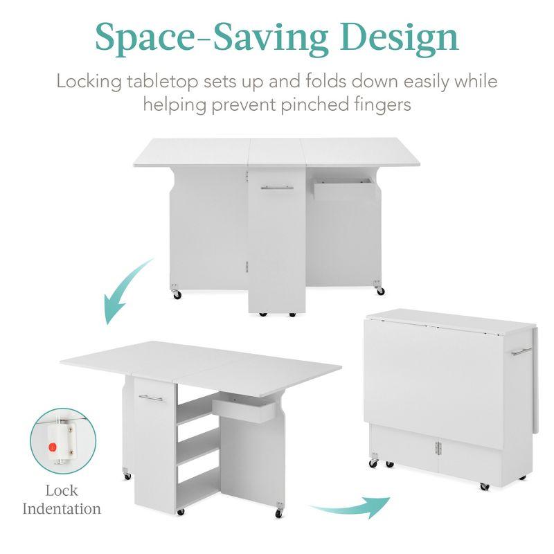 Best Choice Products Multipurpose Folding Table w/ Wheels, 3 Storage Shelves, Cubby, Handle - White