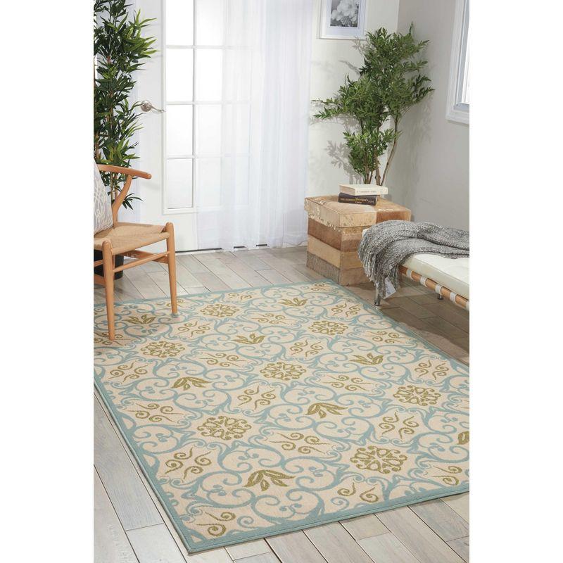 Ivory and Blue Floral Synthetic 9'3" x 12'9" Round Area Rug