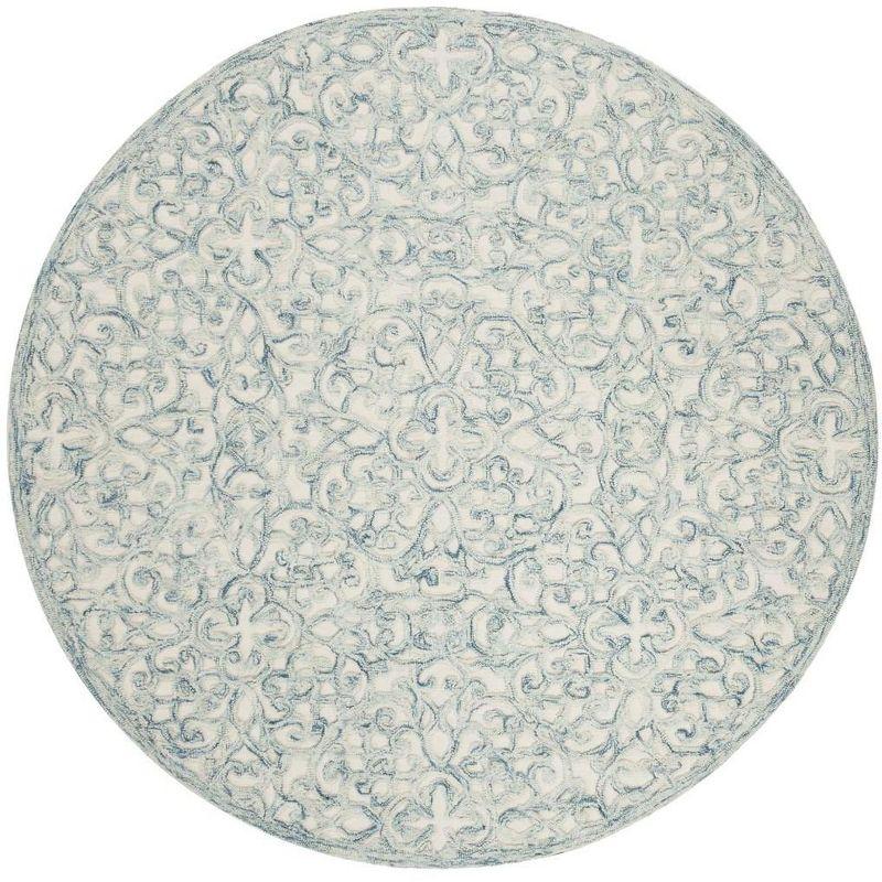 Trace TRC103 Hand Tufted Indoor Area Rug - Blue/Ivory - 6' round - Safavieh.