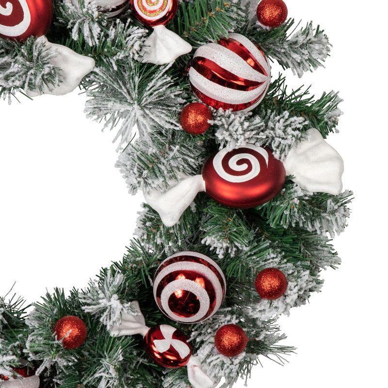 Frosted Pine Artificial Christmas Wreath with Swirled Candy Ornaments 24-Inch