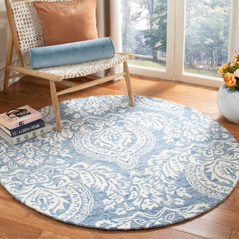 Handmade Blue and Ivory Wool Tufted Round Area Rug