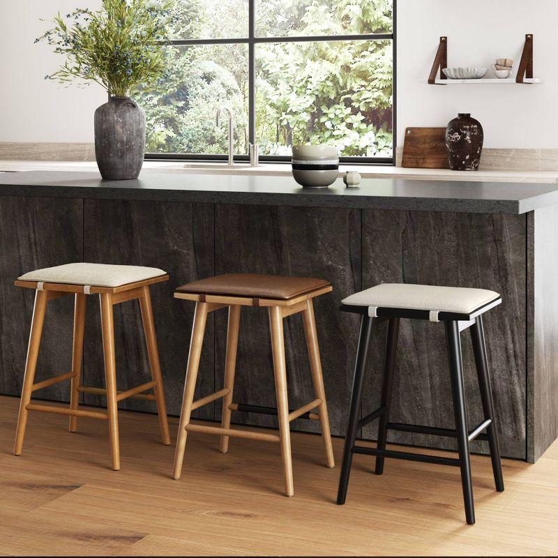 Nathan James Barker Counter Height Barstool: Padded Saddle Seat, Solid Rubberwood Legs, 24" Tall