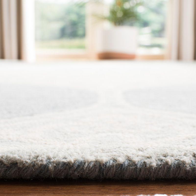 Handmade Tufted Blue and Ivory Wool Area Rug