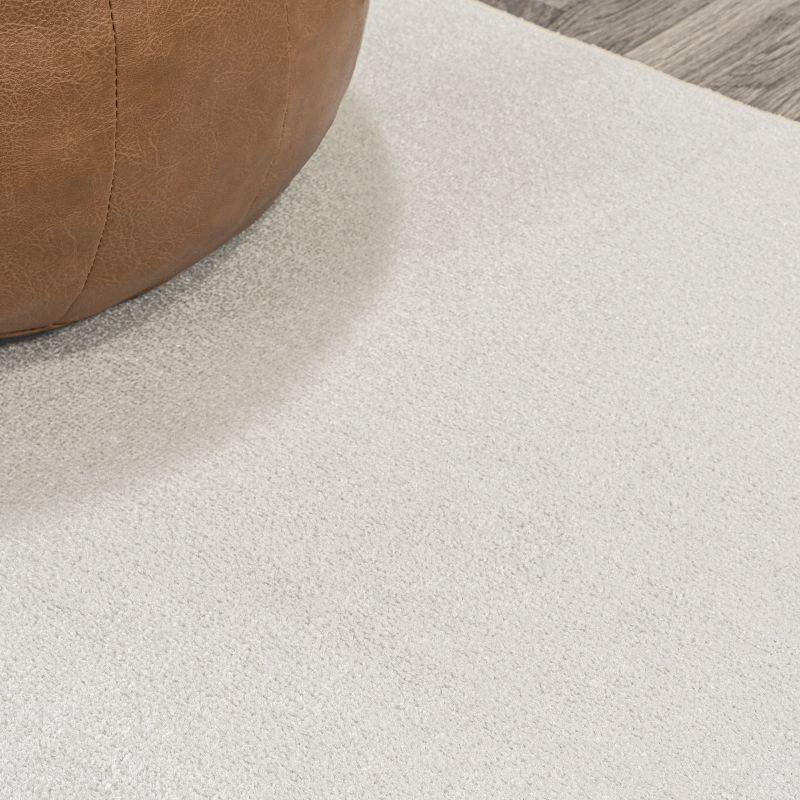 JONATHAN Y Twyla Classic Solid Low-Pile Machine-Washable Cream 4 ft. x 6 ft. Area Rug