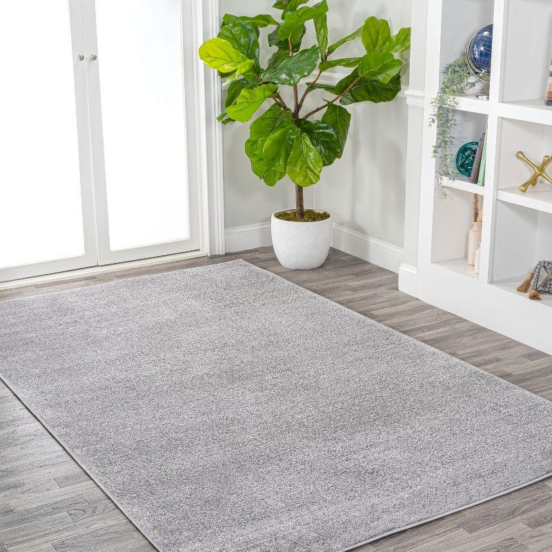 8'x10' Haze Solid Low-Pile Area Rug, Light Gray - JONATHAN Y