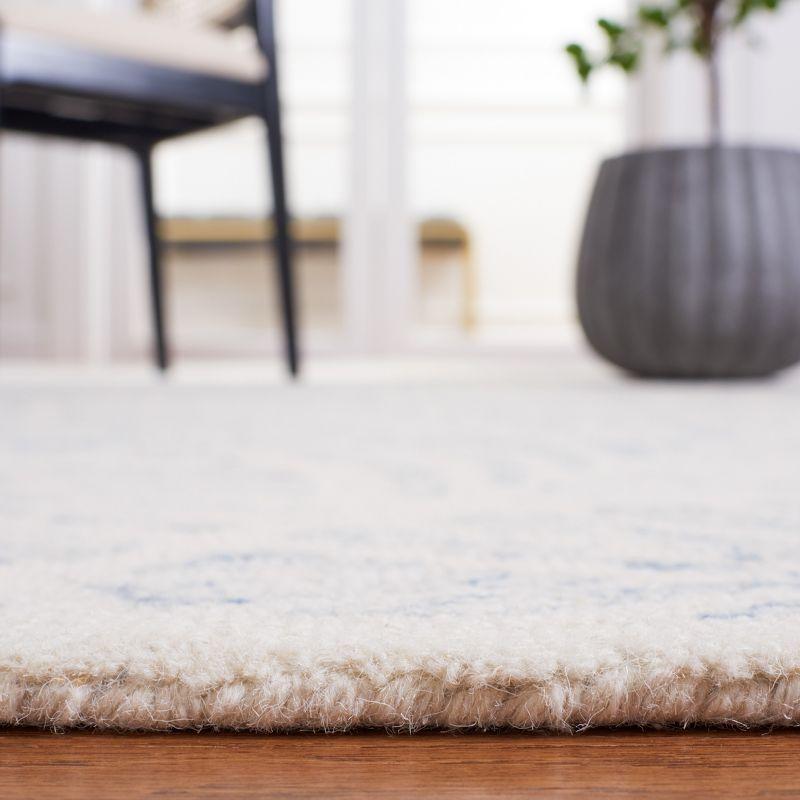 Ivory and Blue Tufted Wool Rectangular Area Rug, 5' x 8'