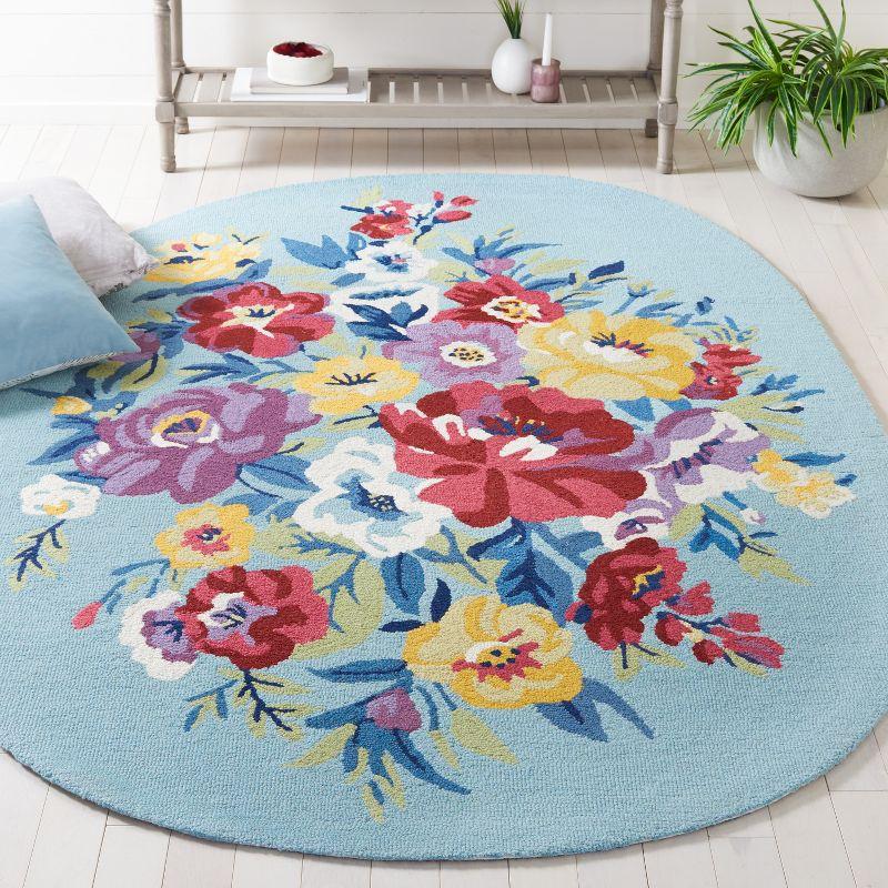 Chelsea HK219 Hand Tufted Area Rug - Blue/Rose - 6'x9' Oval - Safavieh.