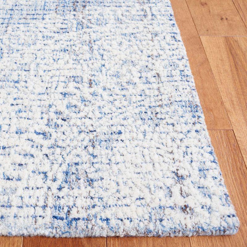 Blue and Ivory Hand Tufted Wool Area Rug 5' x 8'