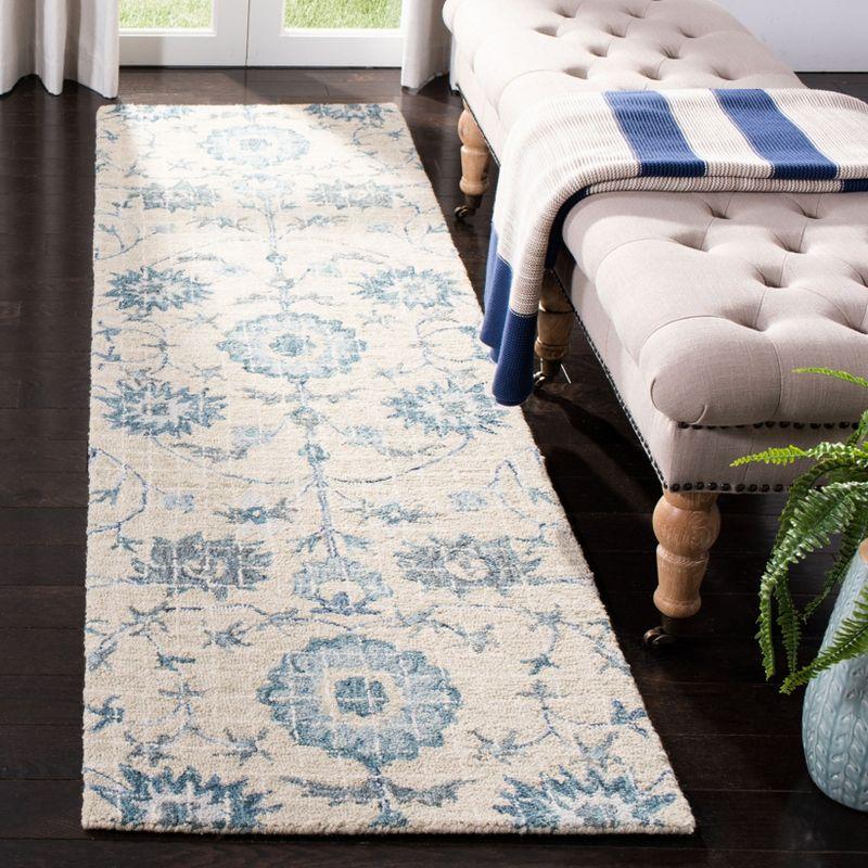 Handmade Tufted Blue Floral Wool Accent Rug