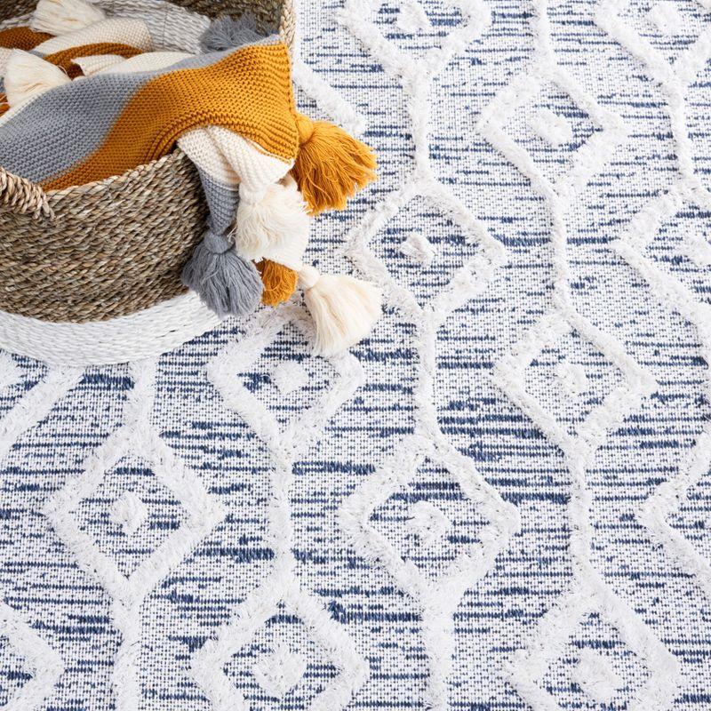 Ivory and Blue Nomadic Pattern 5' x 7' Synthetic Area Rug