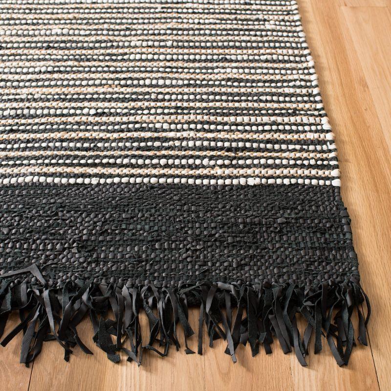 Handmade Vintage Boho Fringe Black & Multi Cowhide Area Rug - 3' x 5'