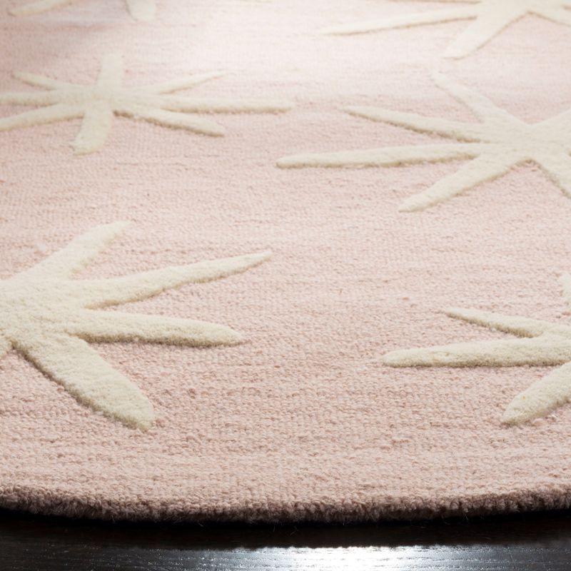 Safavieh Kids SFK908 Hand Tufted Area Rug - Pink/Ivory - 5' round - Safavieh.