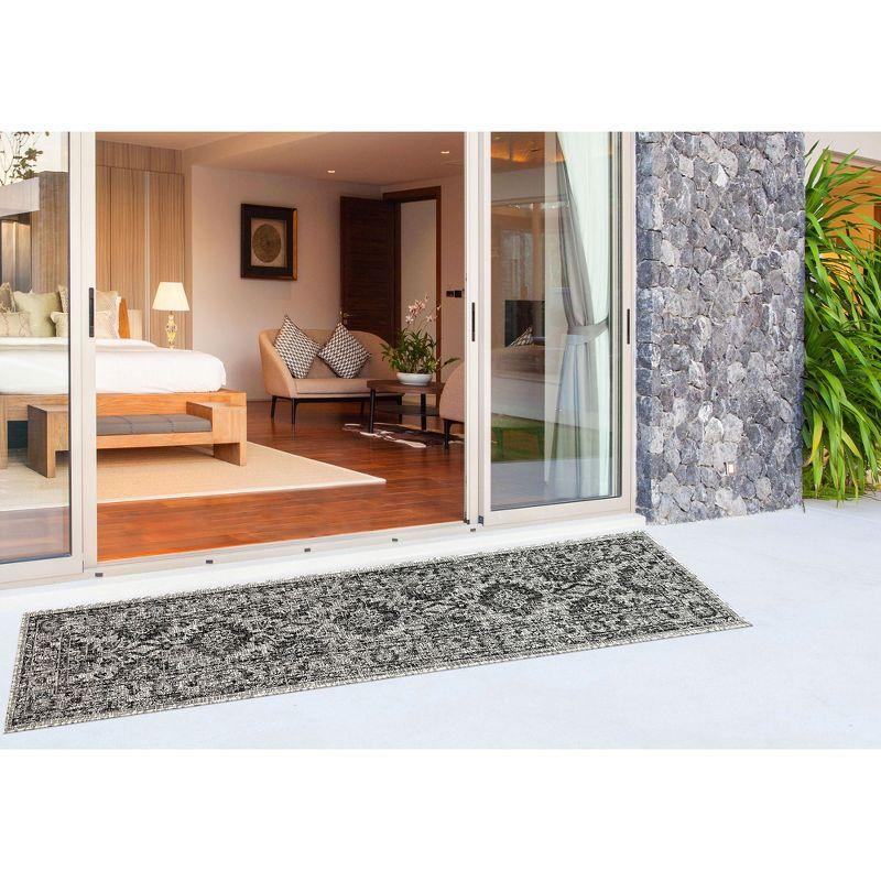 Carmel 24" Black Synthetic Flat Woven Floral Rug