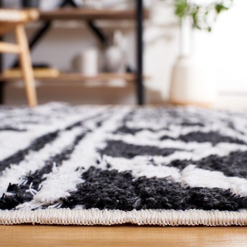 Nomadic Black/Ivory 5' x 7' Handmade Synthetic Area Rug