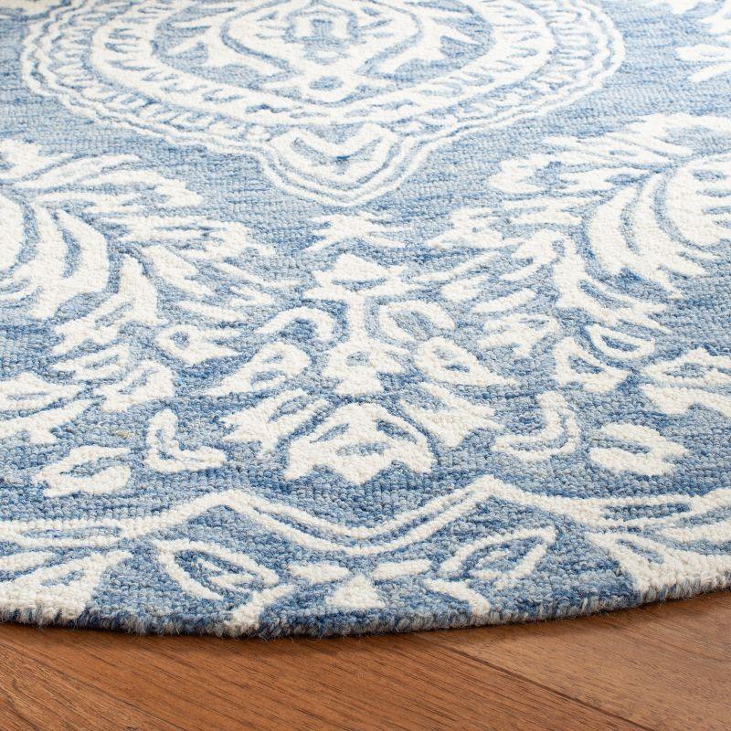 Handmade Blue and Ivory Wool Tufted Round Area Rug